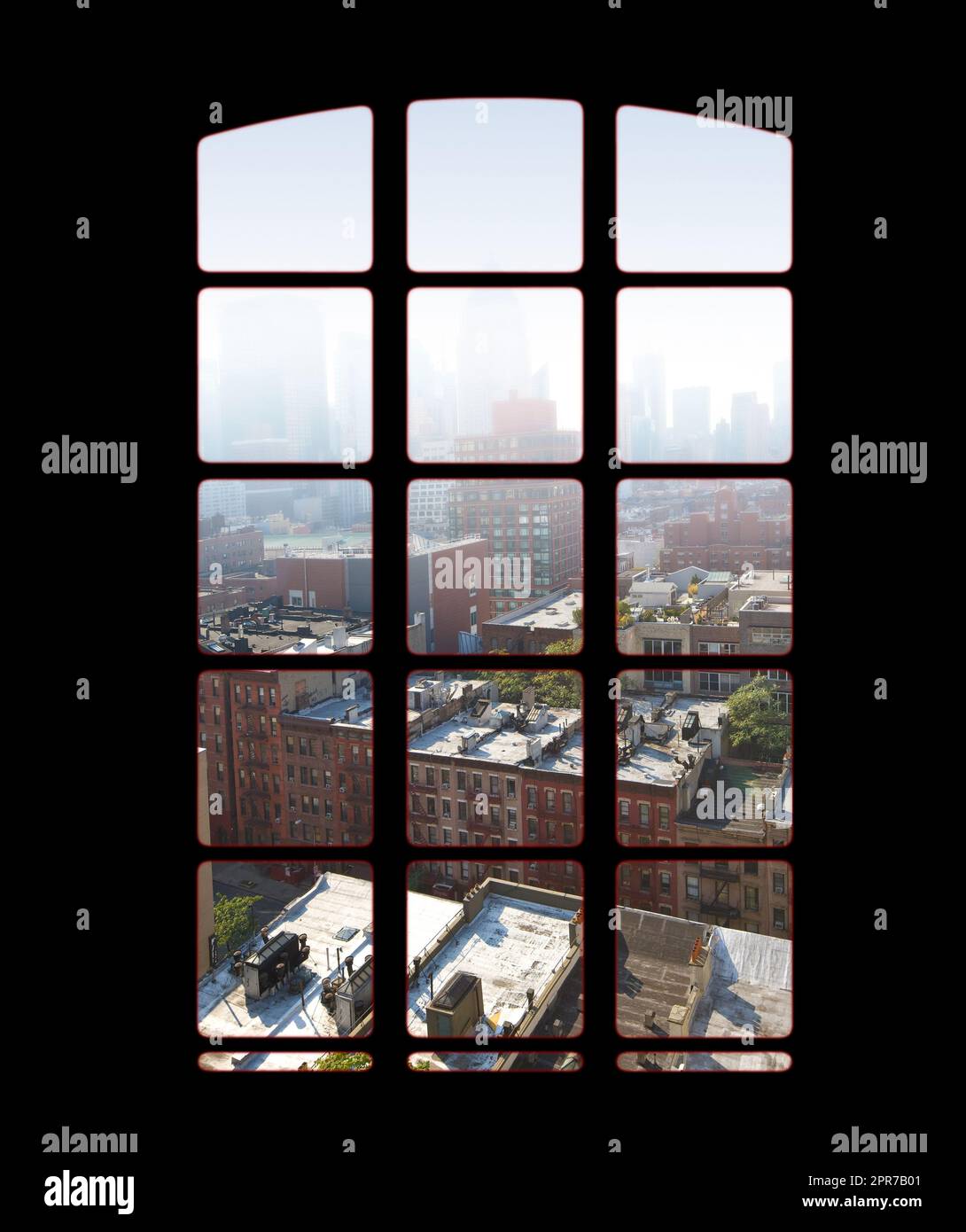 City skyline from an apartment or office window on a bright sunny day. View from inside an empty dark penthouse or hotel room with square glass windows overlooking downtown residential buildings Stock Photo