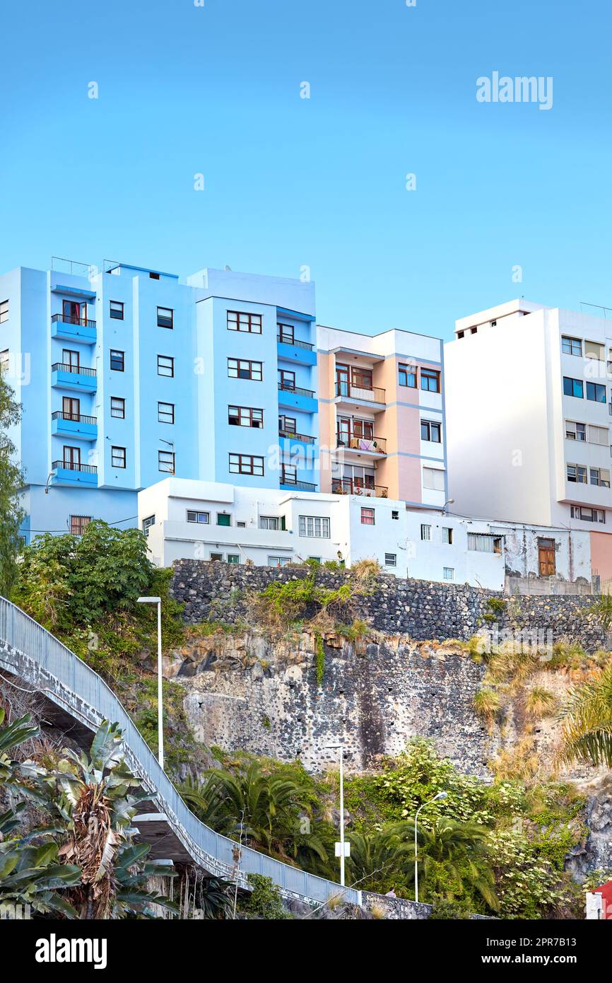 Landscape of modern residential apartments in old city of in Santa Cruz de La Palma with copy space. Beautiful architecture of hotel in Spain with blue sky is ideal for accommodation during vacation Stock Photo