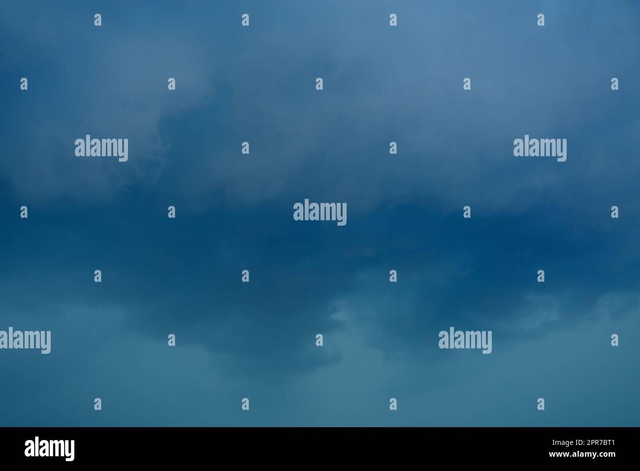 dark storm clouds before rain storm in blue tones Stock Photo