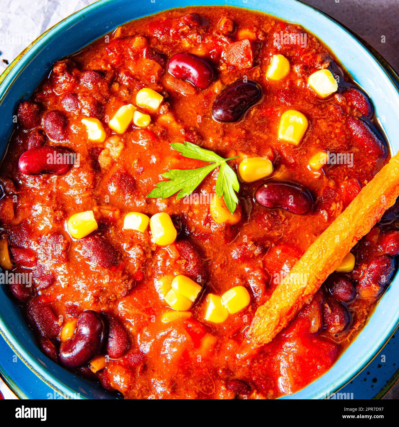 chili con carne with sweet potato and spicy nachos Stock Photo Alamy
