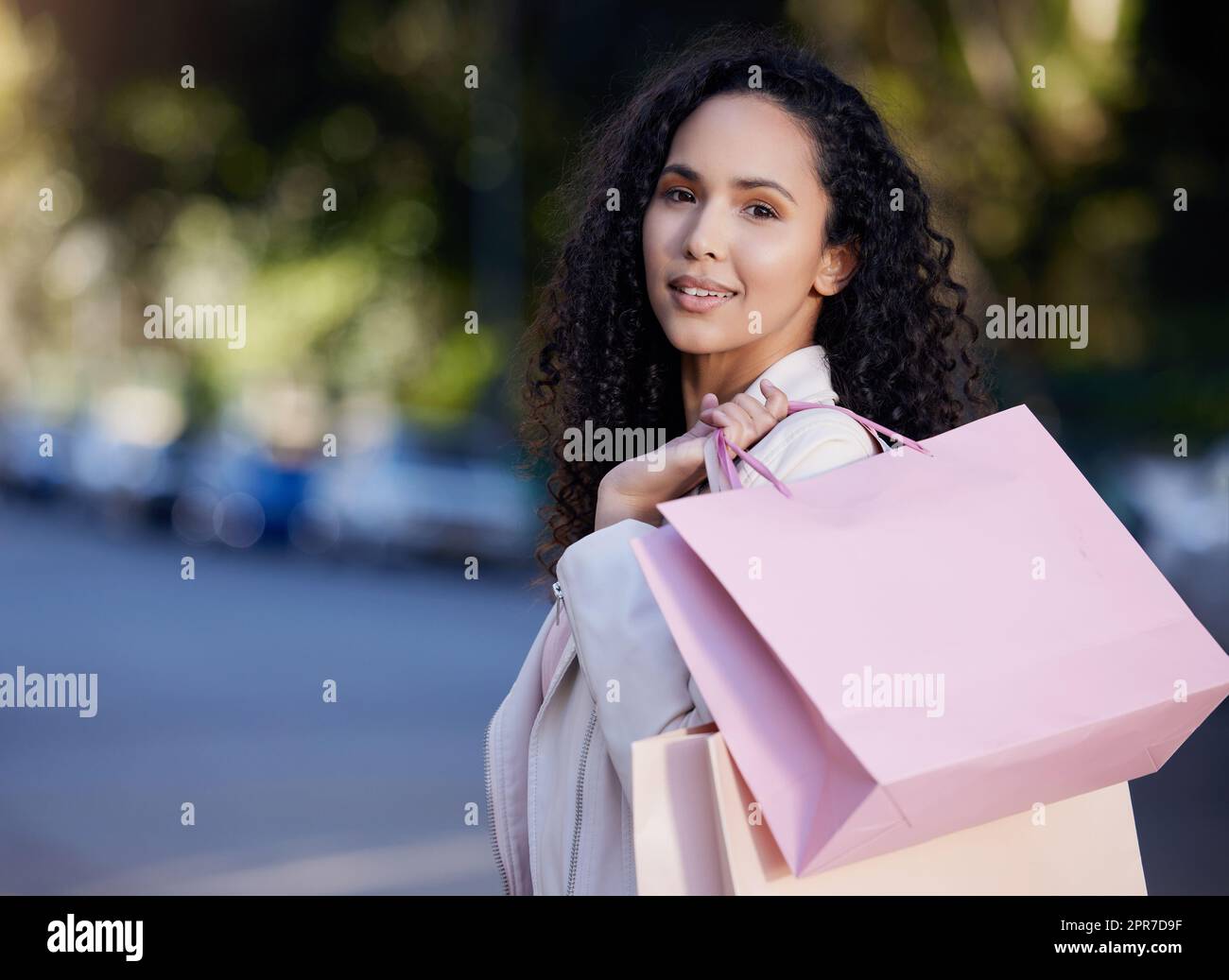 came to get some joy. a young woman out shopping in the city. Stock Photo