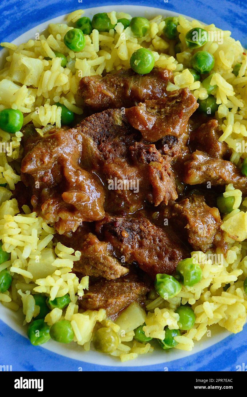 Beef Korma with rice and vegetables Stock Photo