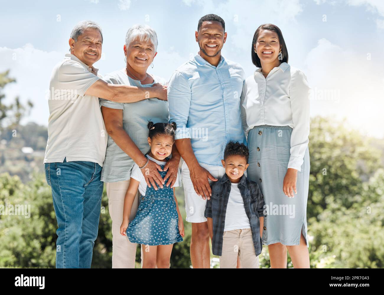 Im so proud of my family. Shot of a multi-generational family standing together outside. Stock Photo