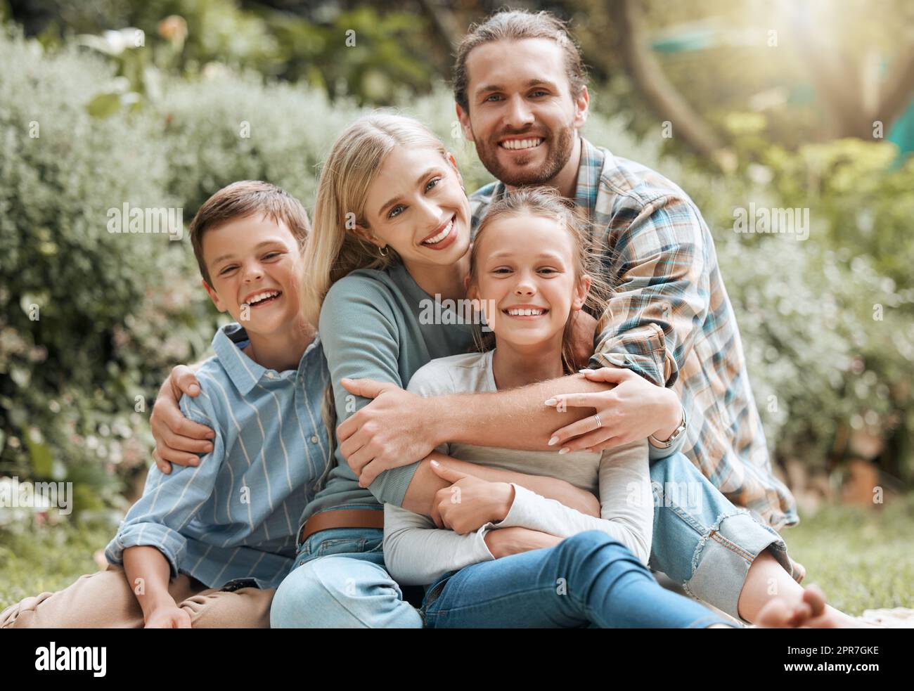 We live for love. Shot of a young family spending some time outside together. Stock Photo