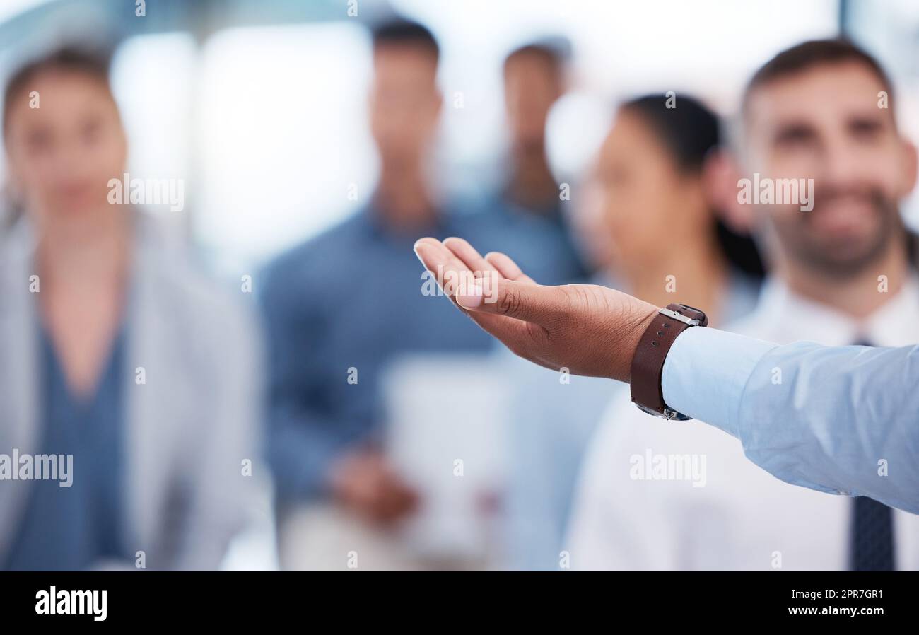 Closeup hand of unknown african american business manager training and presenting to team of businesspeople in office workshop. Black businessman talking and teaching group of professional colleagues Stock Photo