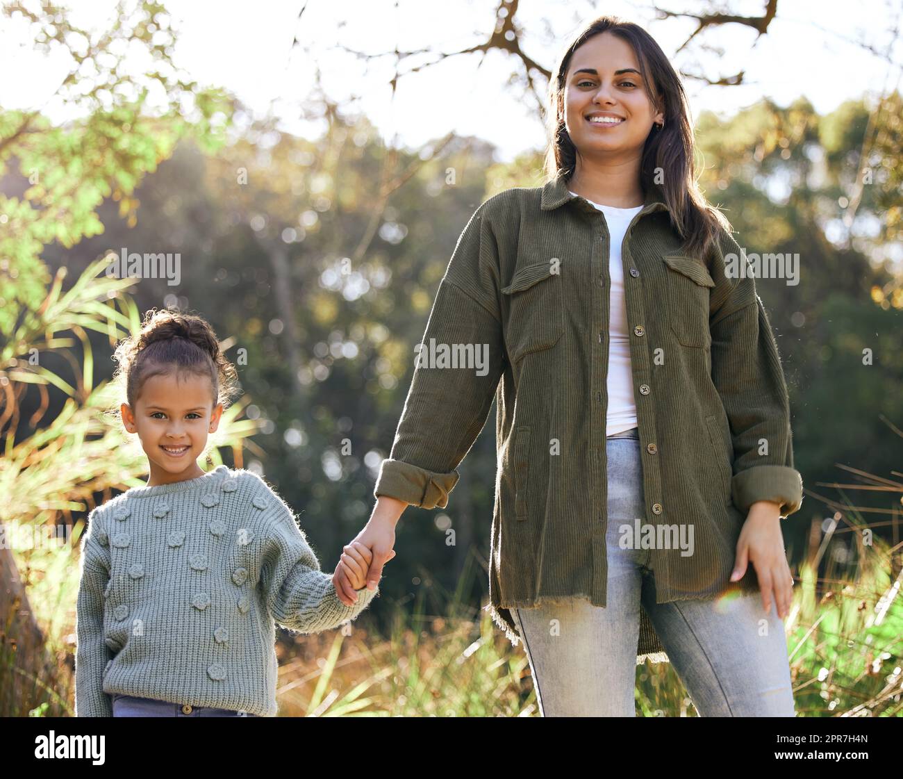 Nature is where we love to be. a young mother and daughter taking a walk in a park. Stock Photo