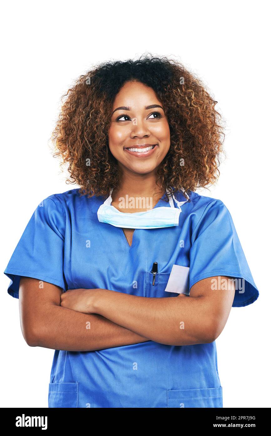 Making a difference with each day. Studio shot of an attractive young nurse looking thoughtful against a white background. Stock Photo