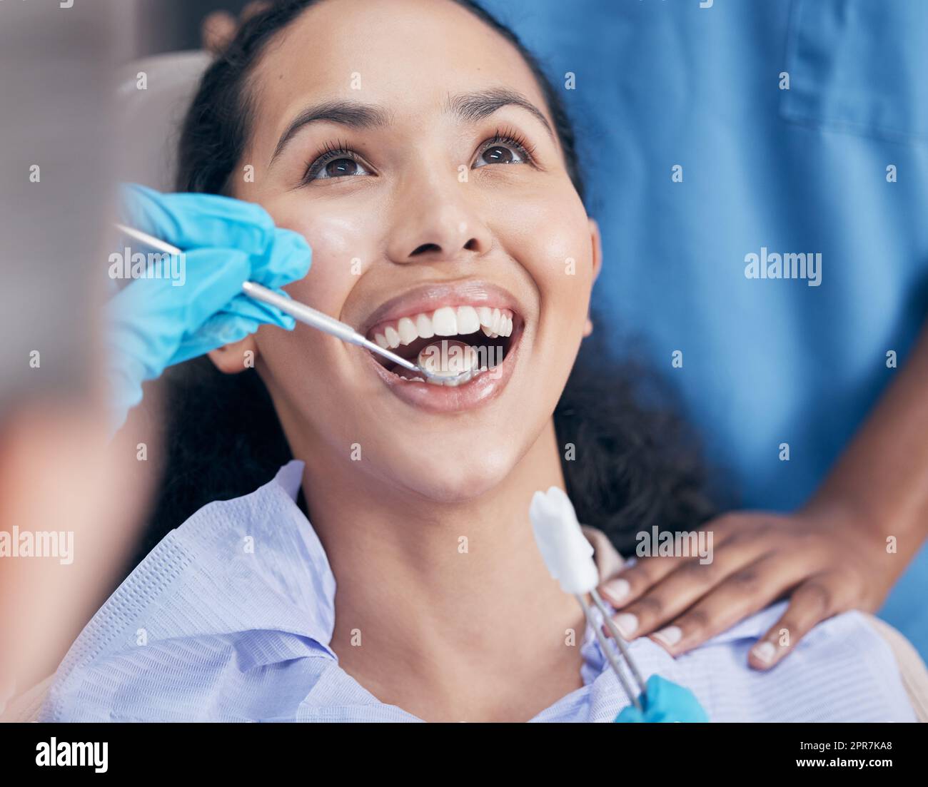 Giving her the best clean. a dentist checking a young patients progress