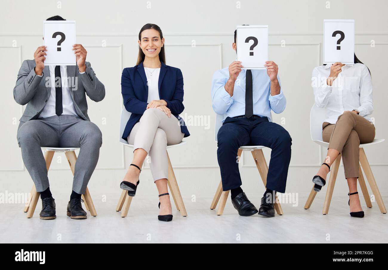 Portrait mixed race businesswoman as selected candidate in group of diverse businesspeople waiting for interview. Team of men and women applicants in line for job opening, vacancy, office opportunity Stock Photo