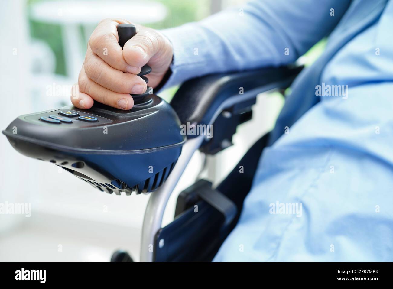 Asian elderly woman disability patient walk with walker in nursing