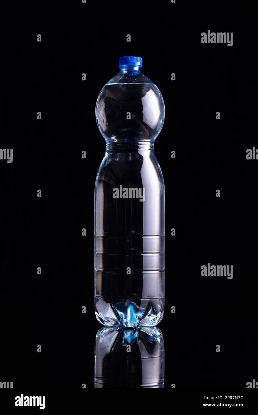 Plastic bottle of water on black background Stock Photo Alamy