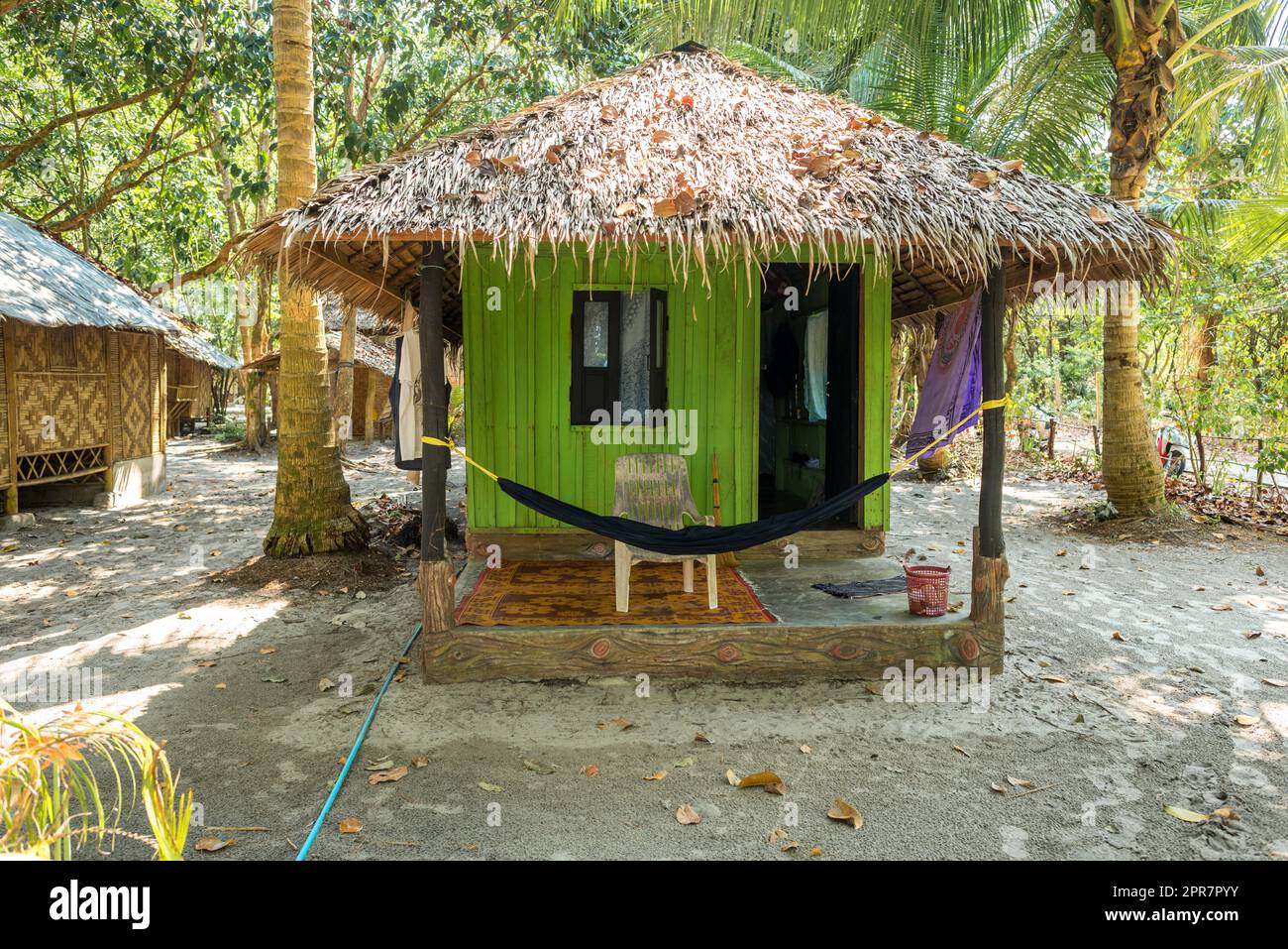 Stylish with palm leaf thatched bungalow at the beachside on Ko Phayam ...