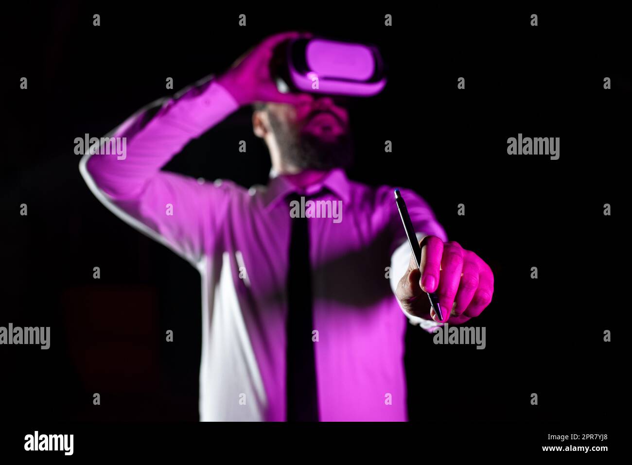 Businessman Wearing Headset Holding Pen While Taking Professional