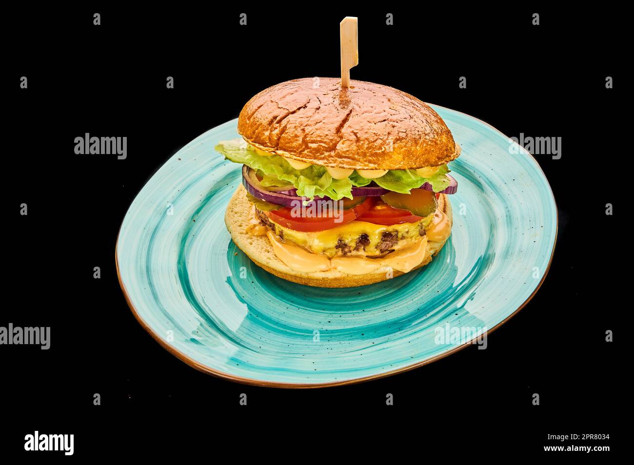 american cheeseburger isolated on a black background Stock Photo