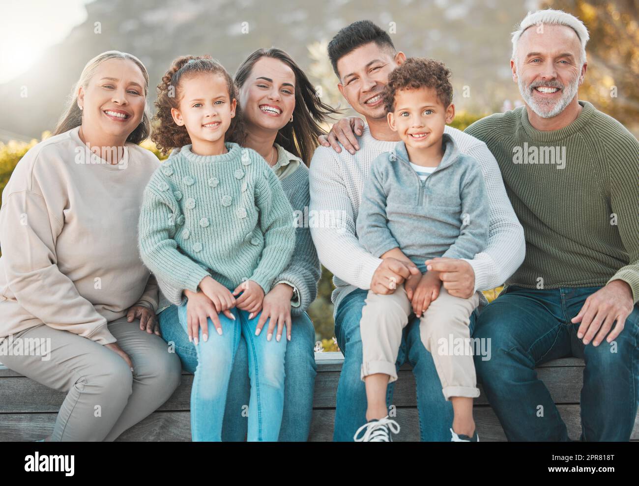 The river of love in families flows deep. Shot of a multi-generational family posing together outdoors. Stock Photo