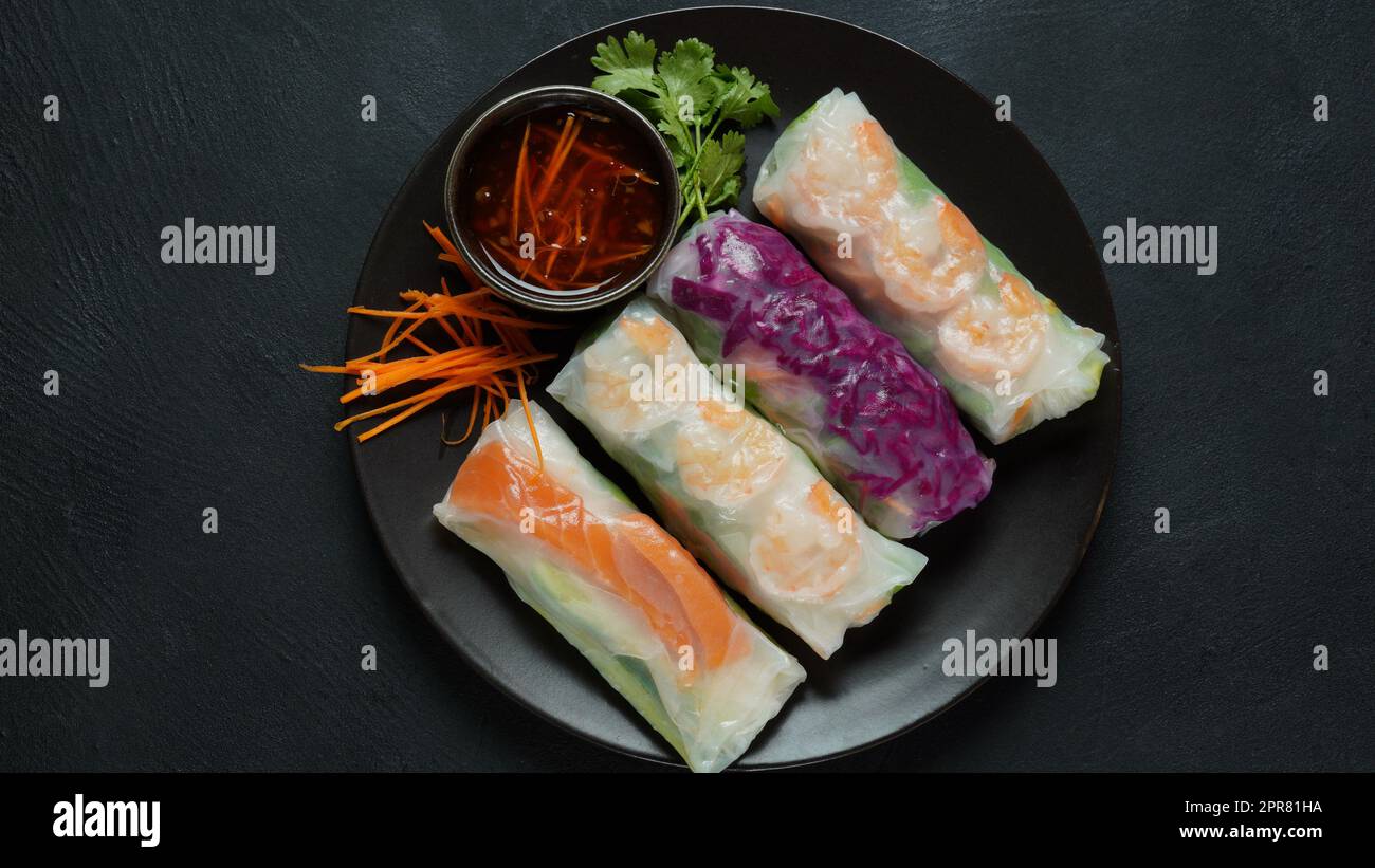 Vietnamese Spring Rolls Goi Cuon or Nem Cuon, filled with prawns, herbs, rice vermicelli and