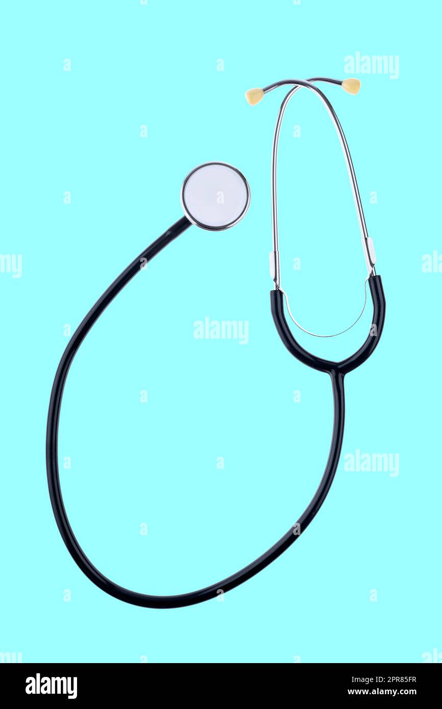 Medical stethoscope isolated on mint green background Stock Photo Alamy