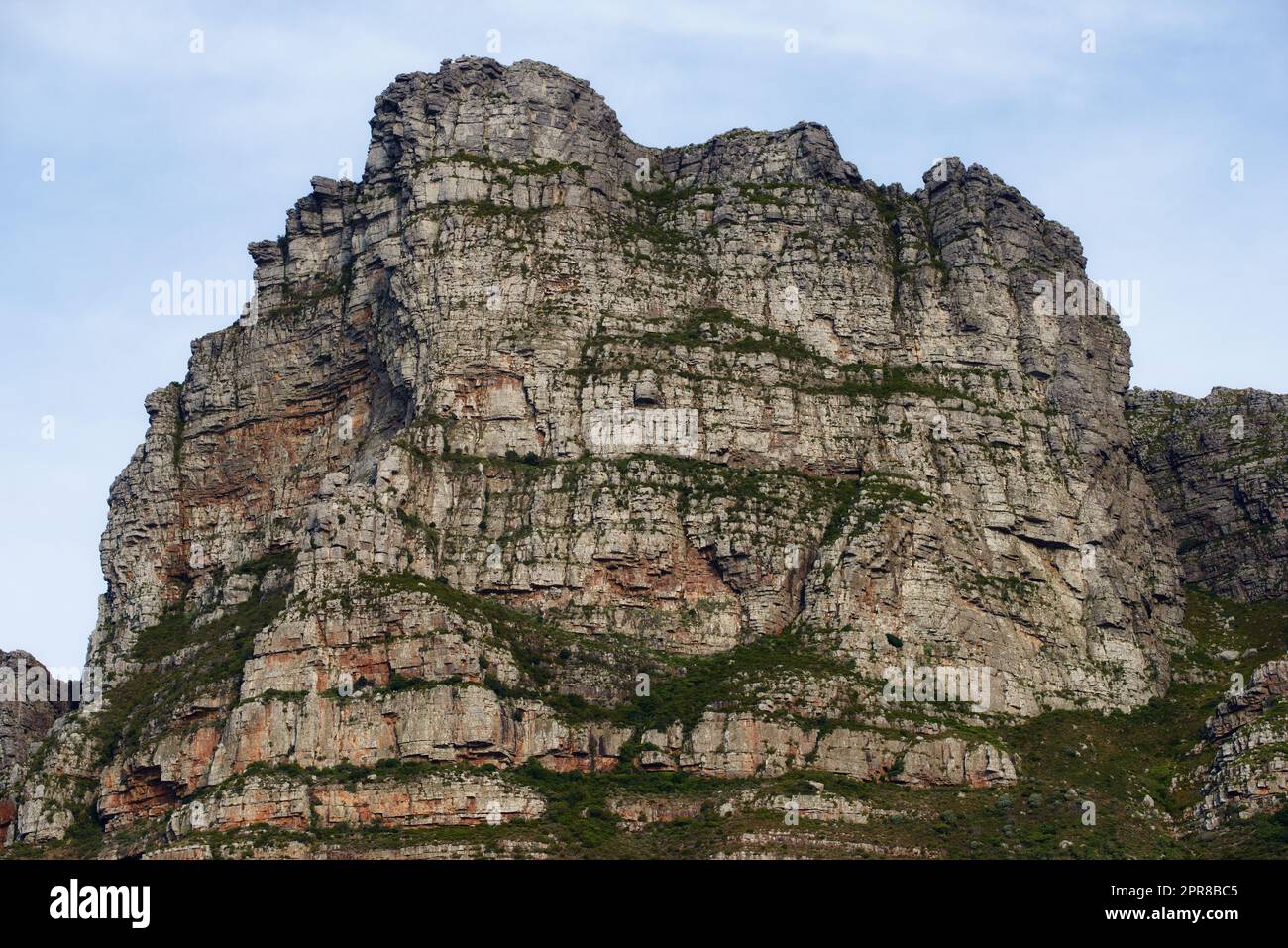 Panorama view of Lions Head mountain in Cape Town, South Africa during summer holiday and vacation. Scenic landscape of rock and texture hill in a remote hiking area against blue sky. Stock Photo