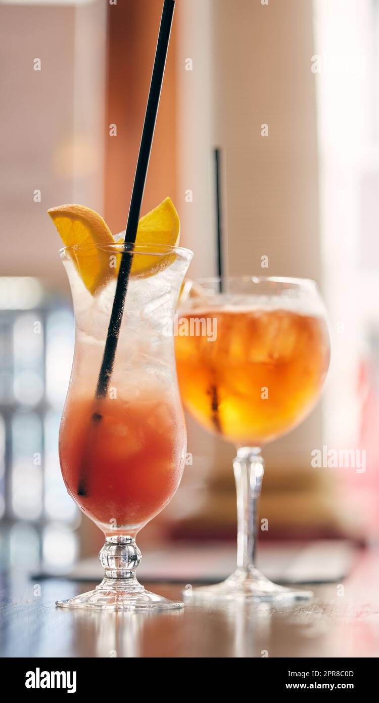 Get the night started with something sweet. two cocktails on a table in a nightclub. Stock Photo