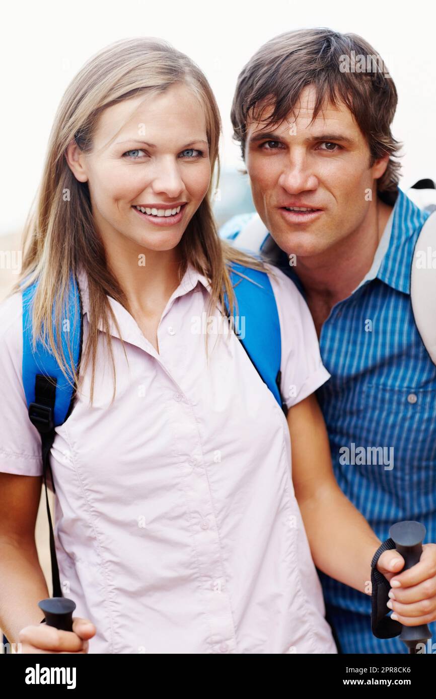 Ready for hiking. Portrait of cute couple with backpack ready for hiking. Stock Photo