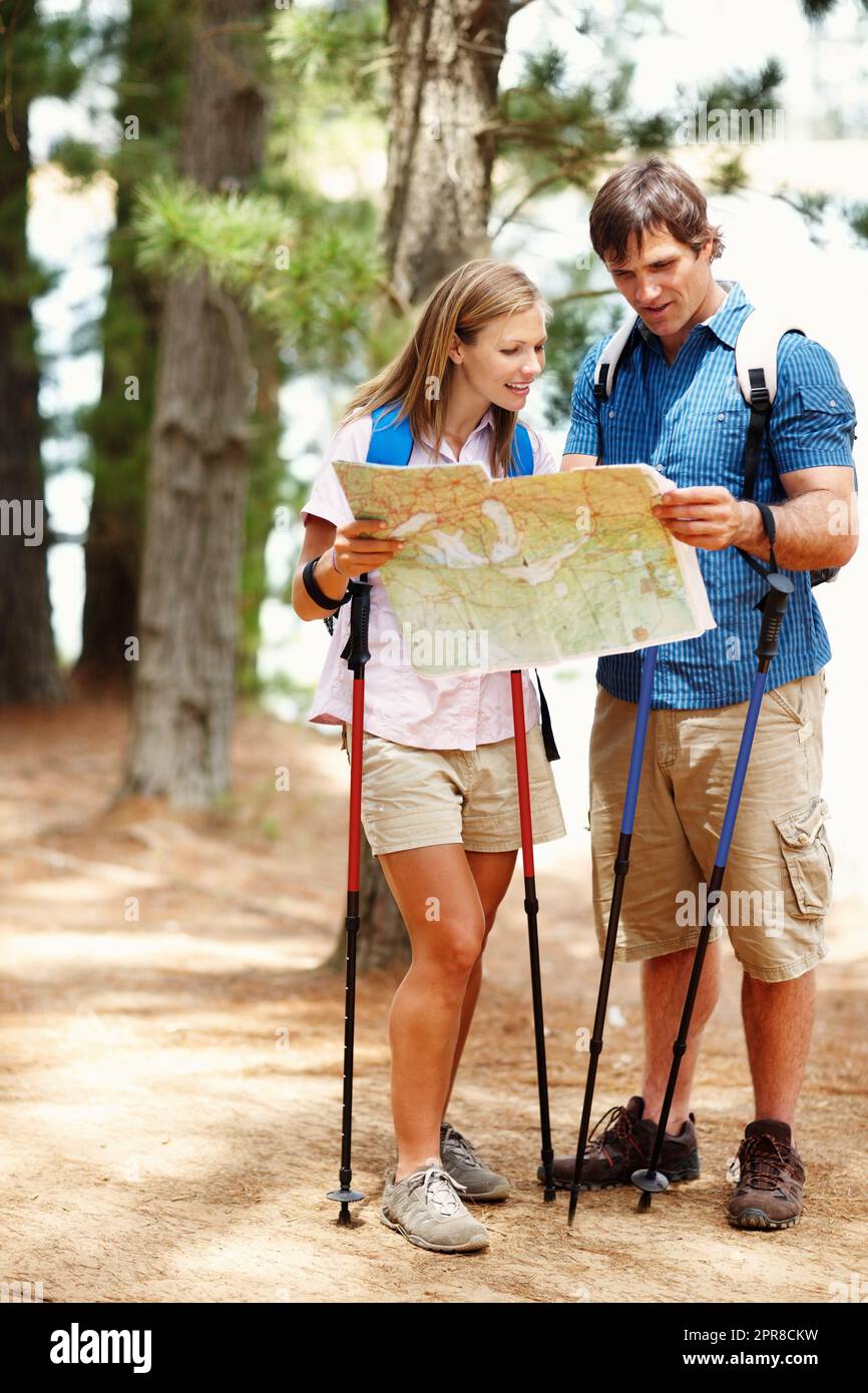 Two hikers looking at a map hi-res stock photography and images - Alamy