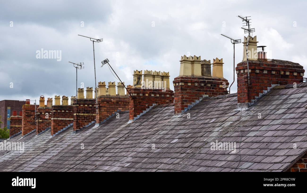 Clay chimney pots on rooftops Stock Photo