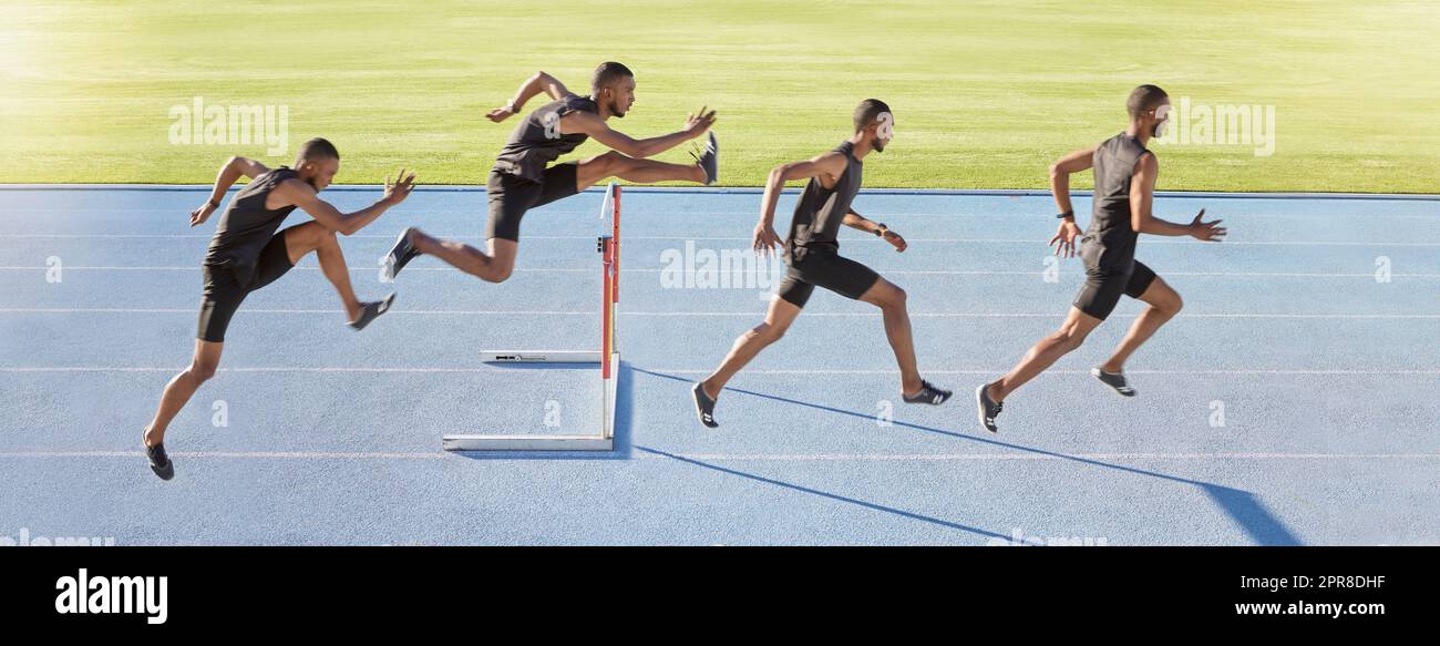 A male athlete jumping over a hurdle. Sequence of a fast professional sprinter or active track racer running over an obstacle. Sports man training for a track and field race on a sunny day Stock Photo