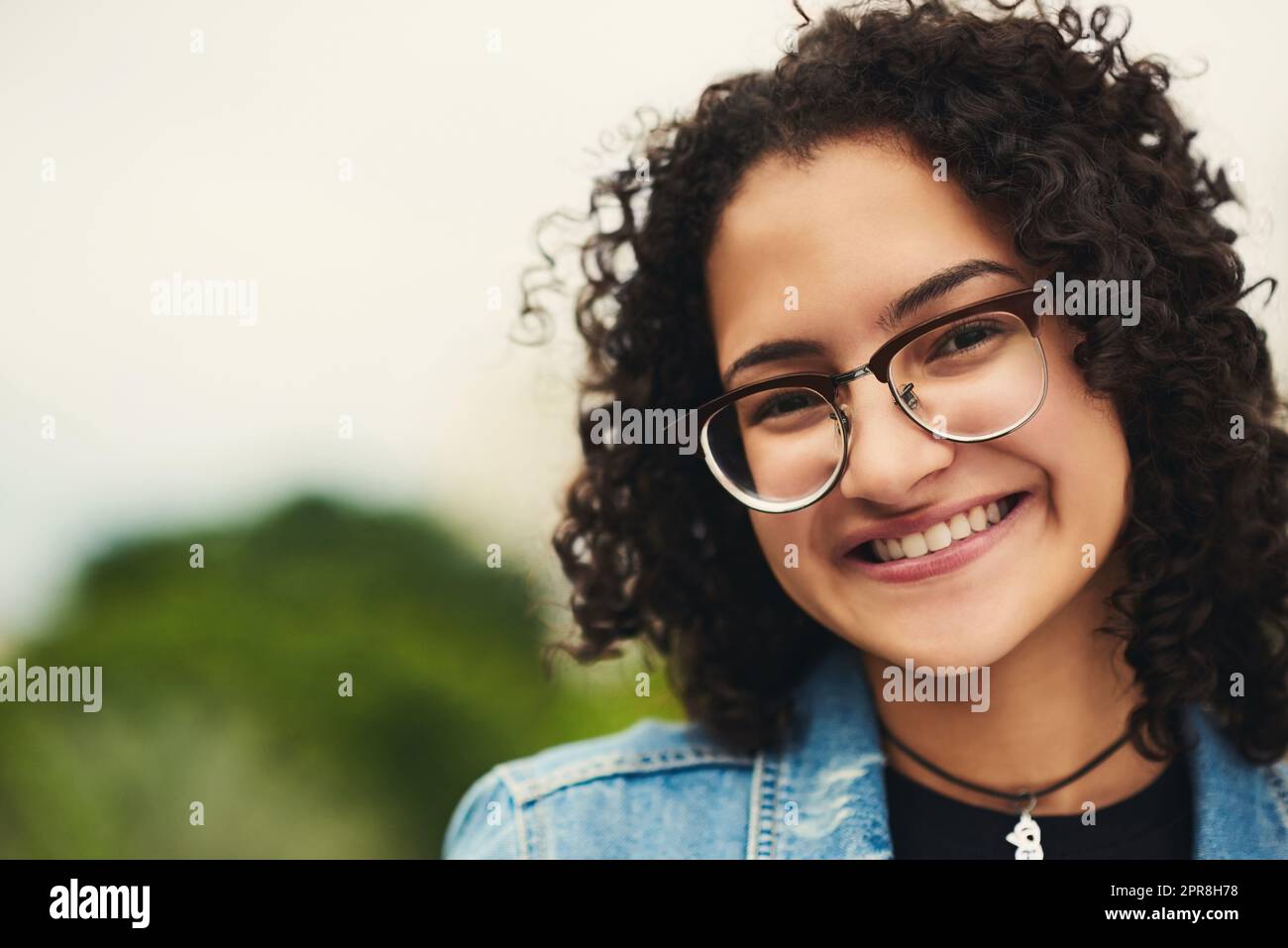 I smile for the beautiful day Im having. Portrait of a beautiful teenage girl outdoors. Stock Photo