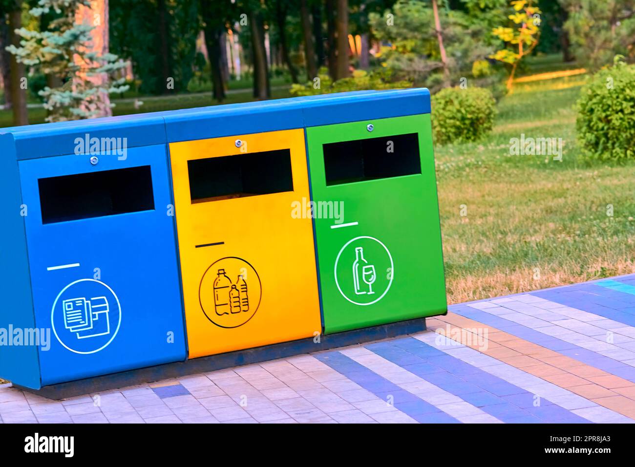 Ecology. Separate waste containers for plastic, paper and glass in a