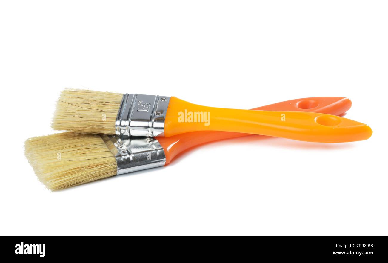New paint brush with orange handle isolated on white background, close up. Set Stock Photo