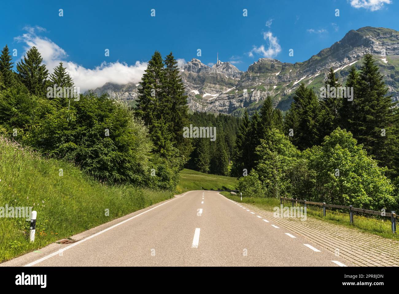 Mountain road with view of the Alpstein massif and Mount Saentis. Canton Appenzell Ausserrhoden, Switzerland Stock Photo