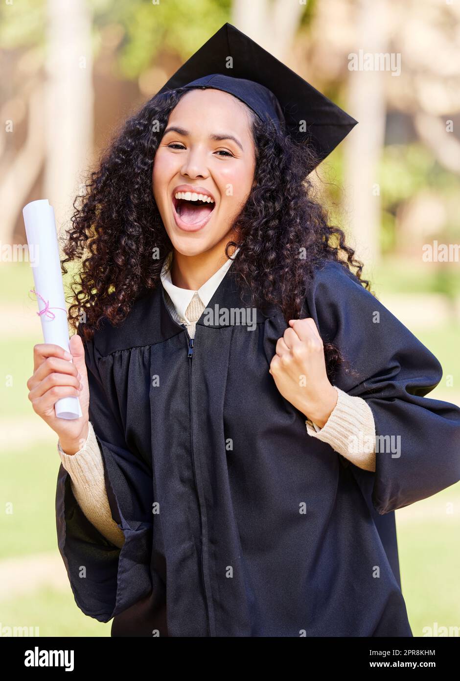 Look at what I snatched today. Portrait of a young woman cheering on graduation day. Stock Photo