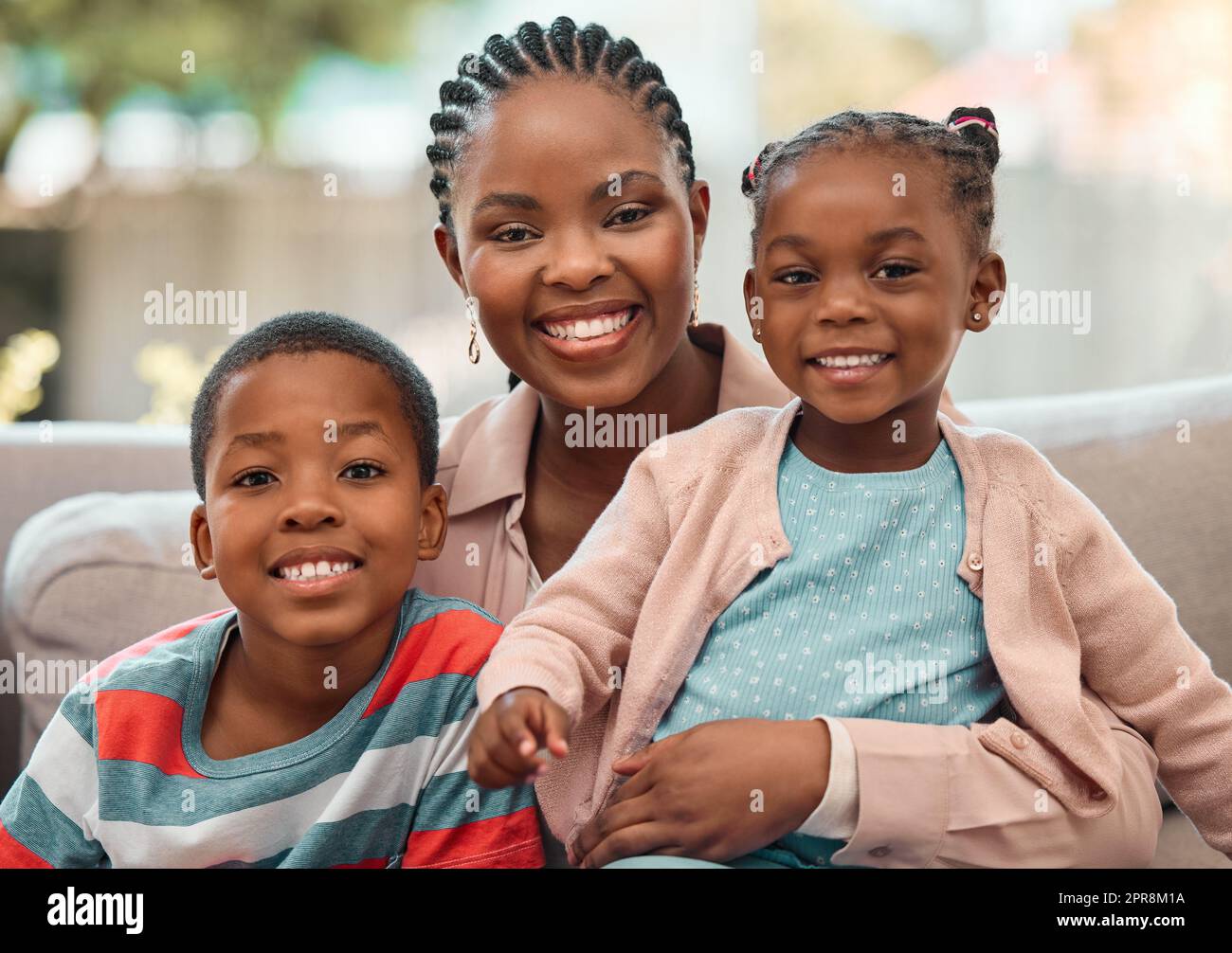 Theyre my pride and joy. a young mother spending time with her children at home. Stock Photo