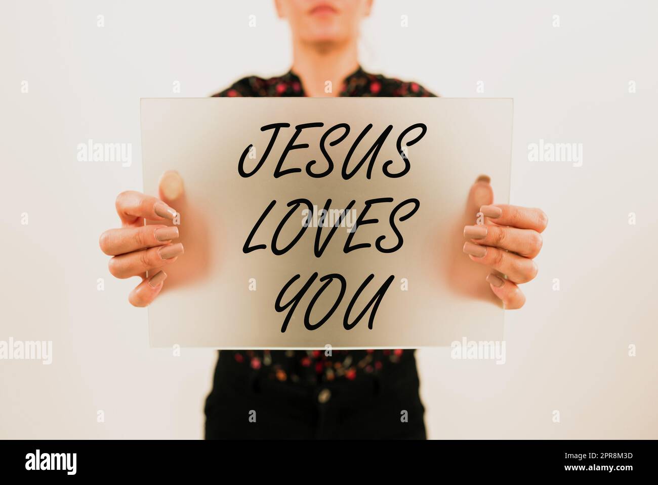 Conceptual caption Jesus Loves You. Business approach Believe in the Lord To have faith religious person Woman Showing Placard And Presenting Important Ideas For Marketing. Stock Photo