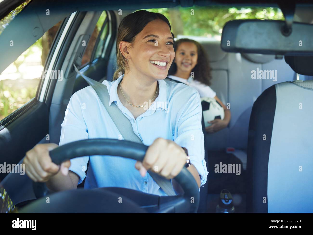 You ready. an attractive young woman driving a car with her daughter in