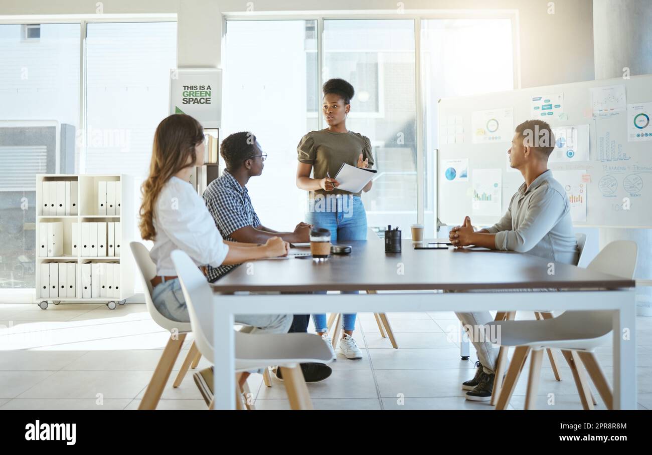 Group of diverse businesspeople having a meeting in an office at work ...