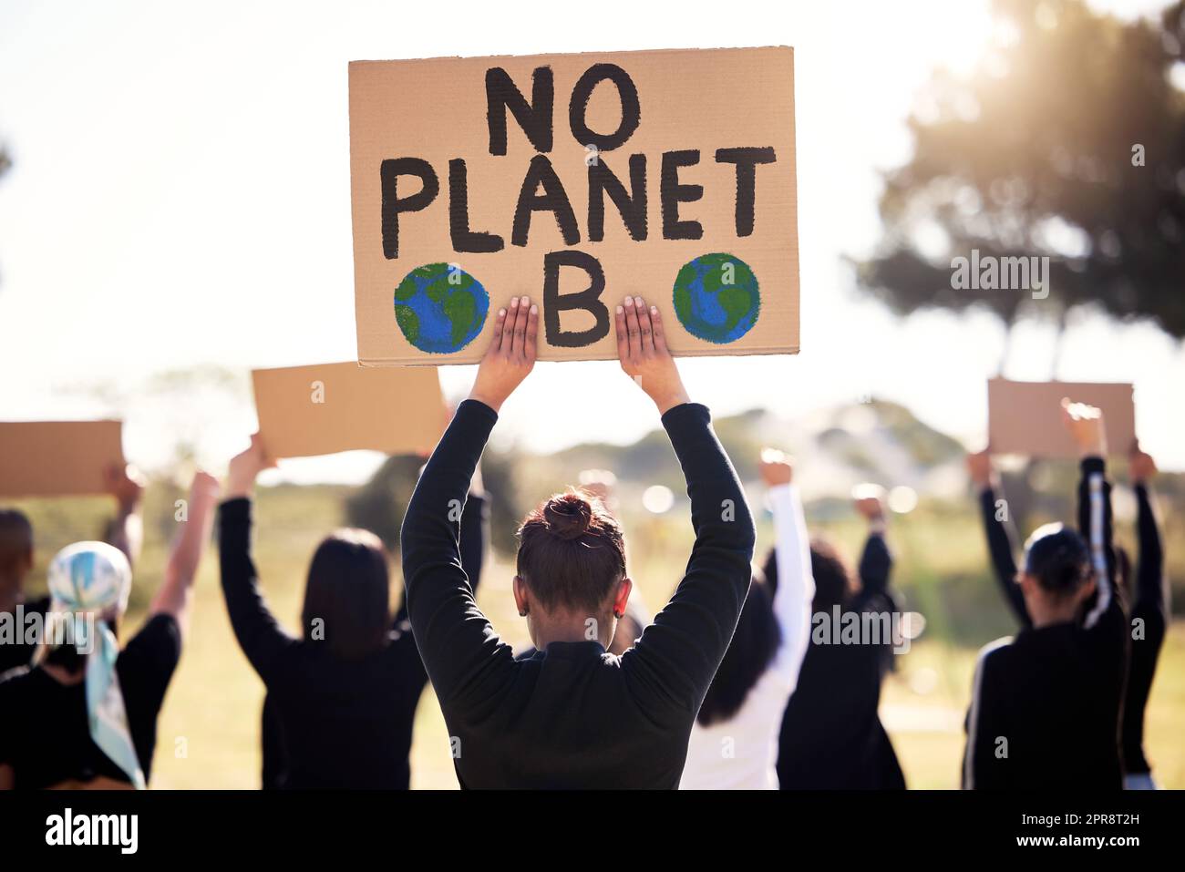 We refuse to be left in regret. a group of people protesting climate change. Stock Photo