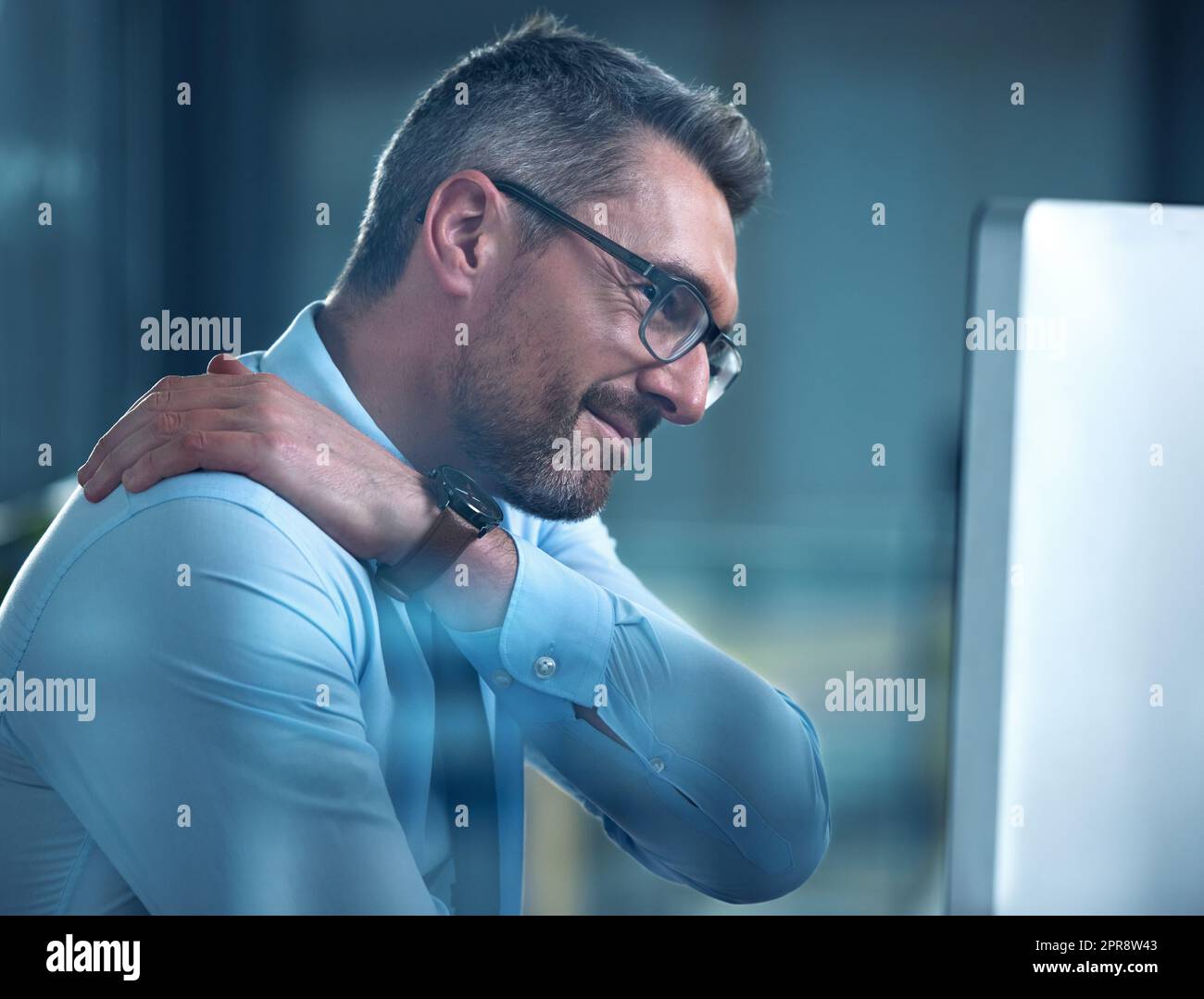 This pain is hard to ignore. a businessman suffering with