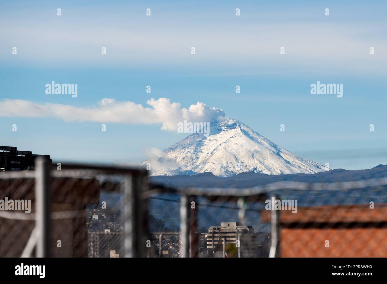 Eruption of Cotopaxi Volcano with ash and steam cloud seen from Quito, Ecuador. Stock Photo