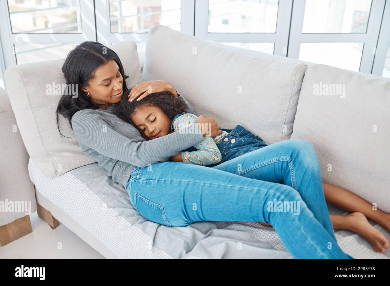Family means putting your arms around each other. a mother and daughter