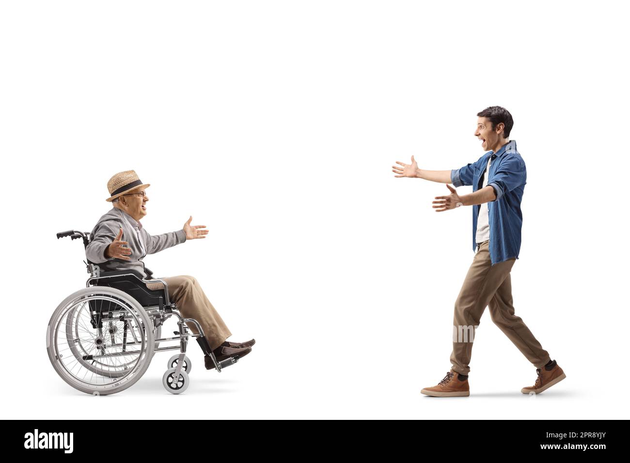Excited young man meeting an elderly man in a wheelchair isolated on ...