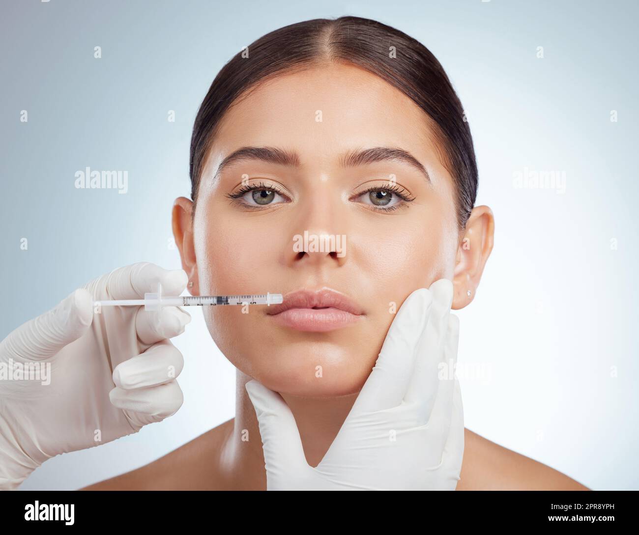 Closeup portrait of woman getting lip fillers or botox. Young caucasian