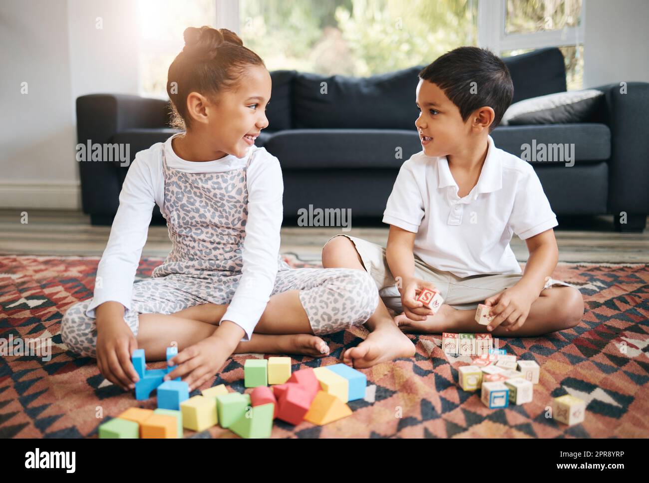 Little kids sitting on floor hi-res stock photography and images - Alamy