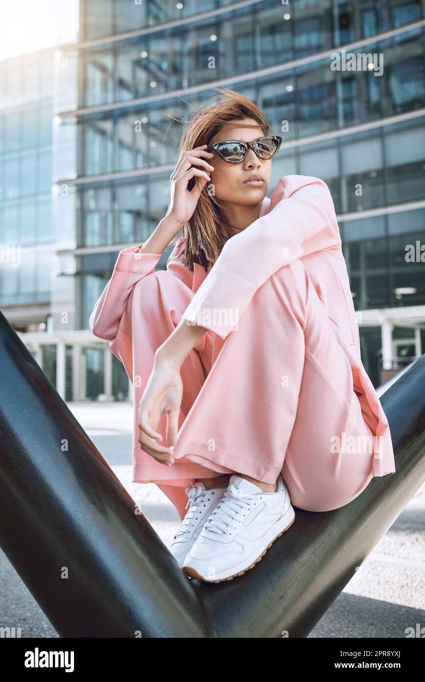 Woman wearing pink sneakers hi-res stock photography and images