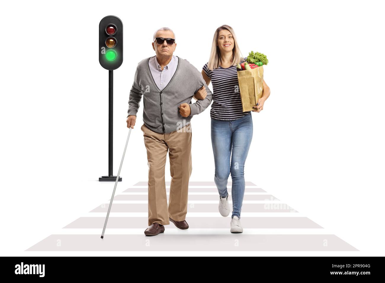 Young female helping an elderly blind man crossing street and carrying