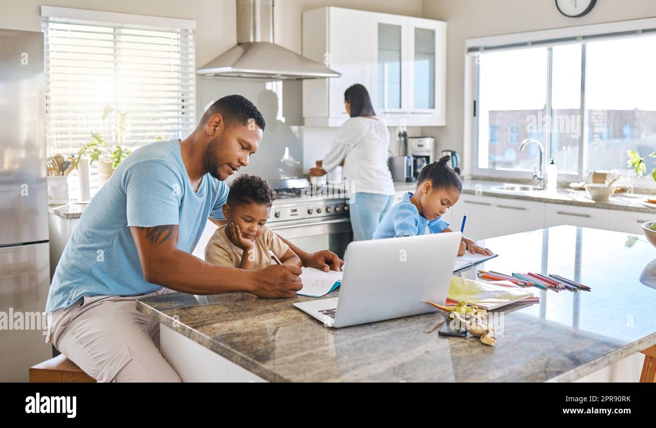 Everyones making progress. parents helping their children with homework at home. Stock Photo