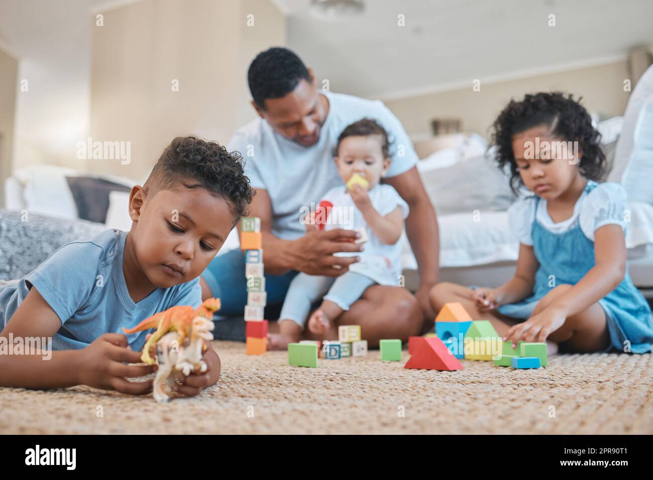 They pretty much entertain themselves. a young man playing with kids on