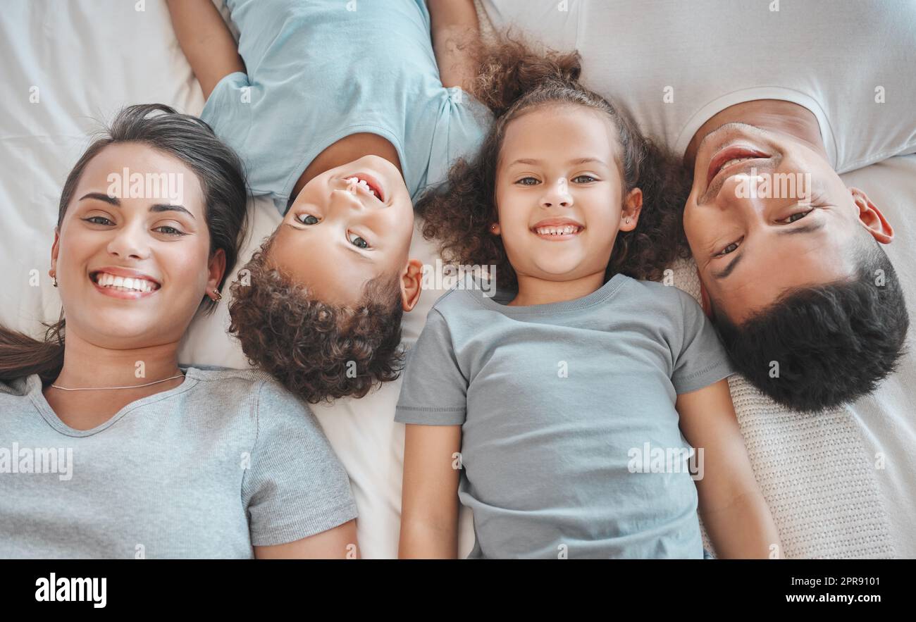 Can you see us better. a young family spending time together at home. Stock Photo