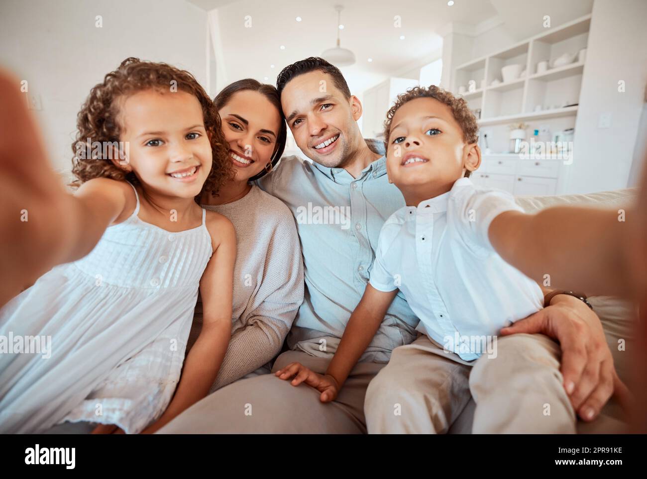 This is our life. a young family taking a selfie at home. Stock Photo