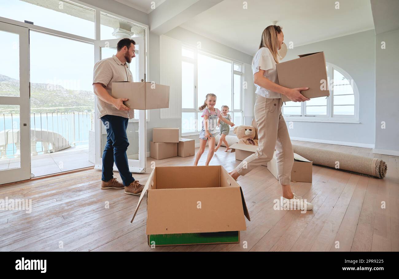 Making our dreams come true. a young family moving into their new home. Stock Photo